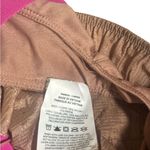 Nike Women's Athletic Shorts in Tan with Pink Accents Photo 2