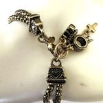 Premier Designs gold tone cross ring crown charm bracelet Photo 1