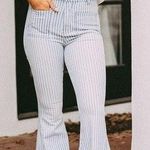 These Three Boutique Light stripe Denim Flares Photo 0