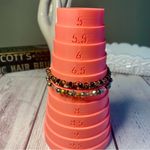 Beaded Bracelets in Black, Gold, and Silver Photo 1