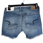 American Eagle  Midi Super Stretch Denim low rise Jean Shorts fringe hem size 0 Photo 1