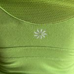 Athleta Green and black athletic top, built in bra with padding, great condition, size small Measurements: Bust: armpit to armpit 14-15 inches Length: shoulder seam to bottom 25 inches Photo 5