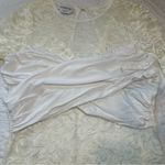 Bebe White Lace Sheer Long Sleeve Bodysuit. Size: Medium. Photo 3