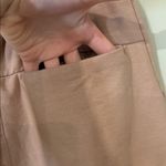 Free People movement dusty rose colored joggers with ankle zip and drawstring Photo 3