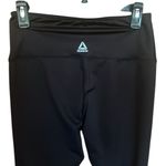 woman’s shiny black with Reebok on leg silver Leggings yoga workout Photo 4