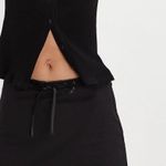 Free People NWT Nia Olivia black mini skort with lace trim and ribbon tie SZ S Photo 1