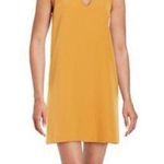 Lulus  Groove Thing golden yellow swing dress with a mock neck and front cutout Photo 0