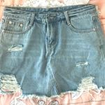 Princess Polly Light Wash Ripped Denim Skort Photo 0