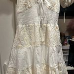 NWT Rubienn Eyelet Tired Back Tie Frill Mini Dress In Off White Size: S pit to pit 8inch Photo 7
