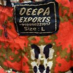 Deep Exports, featuring black background with orange and white circular patterns Size L Photo 11