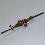 Vintage 1970s gold tone feminine bar brooch with red stones Photo 0