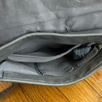 Gray studded faux leather cross body bag. Magnetic snaps on the front. Photo 6