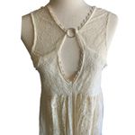 Free People -DONT YOU DARE Stunning cream color lace dress, sleeveless, lined, front keyhole opening, V back, skirt has some gold shimmer, excellent condition, size XS Measurements: Bust: armpit to armpit 15 inches Length: shoulder seam to bottom 33 inches Photo 3