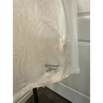 Reebok  Women's White Active Tee Size Large Back Cutout Logo Athleisure Top Photo 1