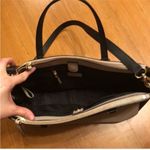 Kate Spade Cream and Black Large Leather Satchel Handbag with Crossbody Strap. Photo 7