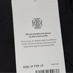 Athleta  NWT Women’s XXS Black Salutation Stash Pocket II Rib 7/8 Tight Leggings Photo 6