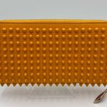 Christian Louboutin
Calfskin Panettone Spiked Zip Around
Wallet Dark Yellow Photo 1