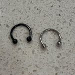 Black and silver septum rings Photo 0