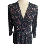 Torrid -WOMENS NAVY BLUE FLORAL TOP-SIZE 2X Gorgeous v neck top, flared bottom, super soft, 3/4 sleeves, has stretch, excellent condition Measurements: Bust: armpit to armpit 23-25 inches Length: shoulder seam to bottom 30 inches Photo 2
