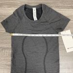 Lululemon Swiftly Tech Short-Sleeve Shirt 2.0
Hip Length - Spandex Black & White Stripe Photo 5