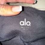 Alo Yoga Vitality Leggings in black with contoured performance lace panels Photo 4