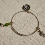 ALEX AND ANI Bracelet - Starbucks - Tinkerbell - bangle, adjustable, charms, silver tone. 2nd Starbucks on the right (Peter Pan movie reference) gently used - no flaws. Smoke free home. Photo 6