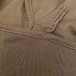 NWOT Bloomingdale’s khaki green tee shirt.Short sleeves.Button closure. Size PS. Photo 5