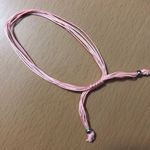 Light Pink Adjustable String Bracelet Photo 1