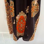 Deep Exports, featuring black background with orange and white circular patterns Size L Photo 10