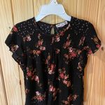 Jolt  Black Top with Vibrant Floral Accents Photo 0
