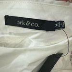 Short white dress with a modern and elegant design. It features long sleeves, Size M Photo 6