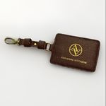 Adrienne Vittadini Adrienne Vitadini Brown luggage tag ID holder brown leather gold tone Logo Photo 1