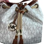 Michael Kors Bucket Bag in the beige monogram print. Photo 13
