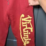 Red Joggers with Bold Yellow Logo Size L Photo 1
