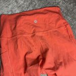 Lululemon  Rise and Flow Pant Mesh Criss Cross Size 4 Orange Coral EUC Photo 7