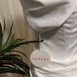Luxxel  White Mini Dress with structure shoulders. Photo 6