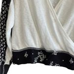 Free People  Auxton Thermal Wrap Top with a floral print Photo 8