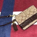 Coach  Signature brown Patent Leather Wristlet coin purse J0849-41637 
4x6” Photo 0