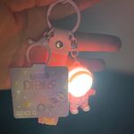 Cute cartoon Astronaut with the sunset light keychain Pink Photo 0