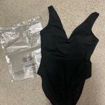 One Piece Black Swimsuit Photo 1