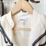 Bebe  Silk Cream Ruffle Neckline Fitted Sleeveless Babydoll Top Photo 2