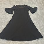 Donna Karan  black dress with bell short sleeves and metal detail neck size‎ M Photo 1