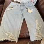 None Brand new denim distressed jorts so
Cool Photo 1