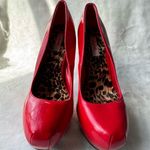 Qupid Vibrant red high heel shoes with an elegant and daring design. Photo 0