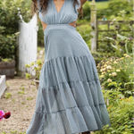 Altar'd State flowy, A-line maxi dress with a tiered skirt and a deep V-neckline or open-back design. Photo 0
