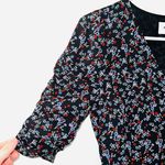 Highline Collective Black Floral Ruched Sleeve Mini Wrap Dress Photo 1