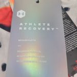 Under Armour Women's UA RECOVER Woven Upstream Camo Jacket Size Large Orange White Black NWT Photo 1