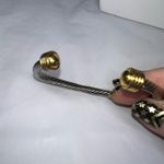 Silver Tone Twisted Cuff Bracelet with Gold Tone Caps Photo 2