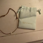 ENewton  cross choker white and brown Photo 0