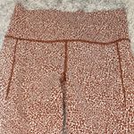 Athleta Leggings Womens Small Orange Salutation Stash II Textured Tight Gym Run Photo 1